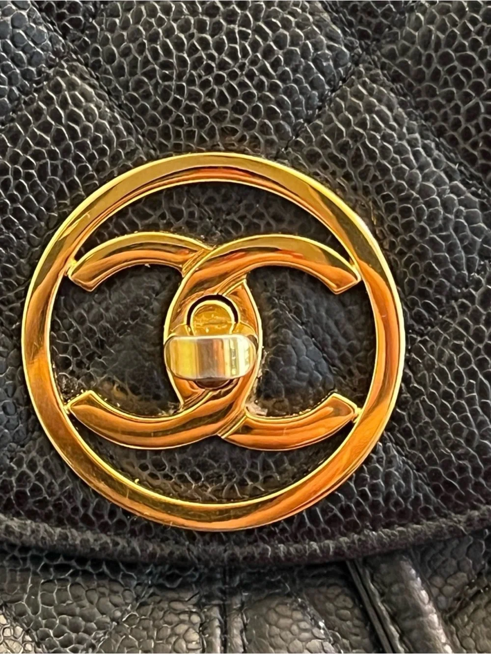CHANEL Black Quilted Leather Backpack with Gold CC Accent